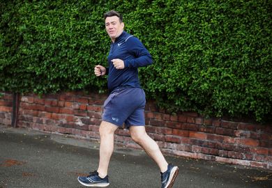 Andy Burnham looking over his shoulder as he jogs outside his home in Greater Manchester, Britain, 18 May, 2026. To illustrate whether universities could achieve a levy U-turn under a Burnham leadership.